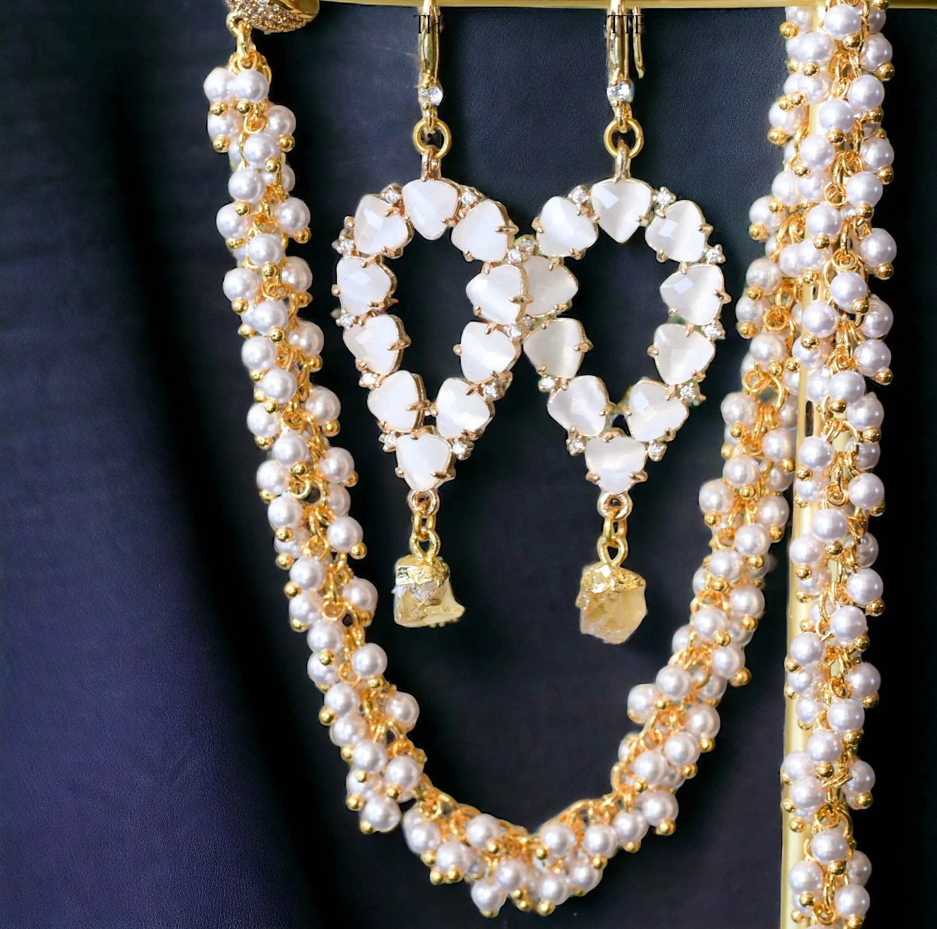 Yara white stones with gold edged aquamarine drop earrings